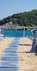 blue and white boards path on the beach