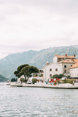 Streets and sights of the old town. Panorama of the city of Perast in Montenegro.