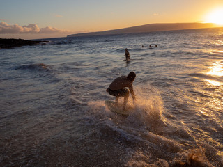 low water surfing on hawaiian beach