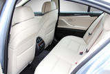 the white rear seat of a luxury passenger car