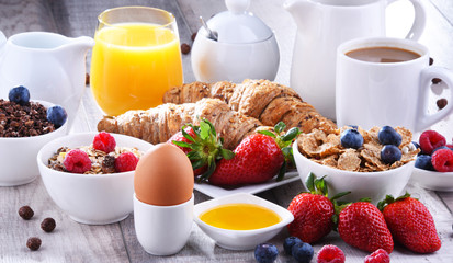 Breakfast served with coffee, juice, croissants and fruits