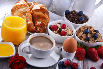 Breakfast served with coffee, juice, croissants and fruits