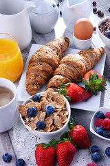 Breakfast served with coffee, juice, croissants and fruits