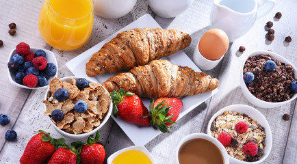 Breakfast served with coffee, juice, croissants and fruits