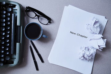 Literature, author and writer, writing and journalism concept: typewriter, cup of coffee and glasses and a paper