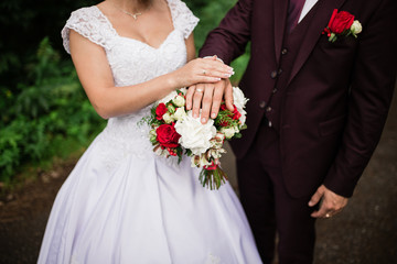 Hands of the bride and groom with wedding rings. Wedding day young