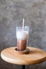 Glass of ice cocoa with  milk foam after finished drinking