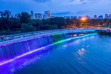 Fototapeta premium The Anh Sao (Starlight) Bridge is located in the heart of the international commercial and financial district of Phu My Hung. It is the first modern pedestrian bridge of Ho Chi Minh City in Vietnam