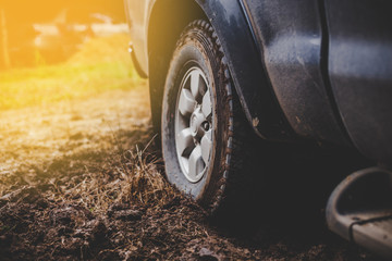 Close-up car tires are dirty on the mud.