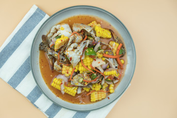 Raw fresh blue swimming crab spicy salad mix with corn