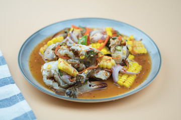 Raw fresh blue swimming crab spicy salad mix with corn