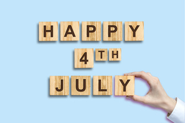 Happy 4th of July background.The inscription on the wooden blocks. Isolated. Independence Day United States of America background. Festive background.