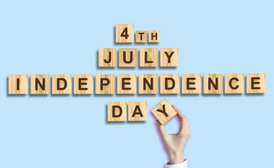 Independence Day. The inscription on the wooden blocks. Isolated. Independence Day United States of America background. Festive background.