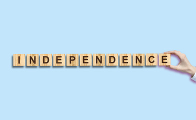 Independence Day. The inscription on the wooden blocks. Isolated. Independence Day United States of America background. Festive background.