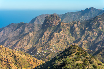 Volcanic plug in Vallehermoso what means the beautiful valley in english. View to the Roque Cano, a famous volcanic neck on the north side of La Gomera
