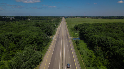 Aerial Shot Of A Highway Passing Through The Rural Countryside