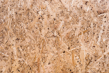 Plywood board texture.  Compressed sawdust panel background. Wood surface for interior design and decoration.