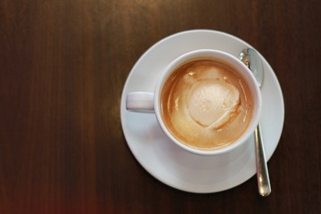 cup of coffee on wooden table