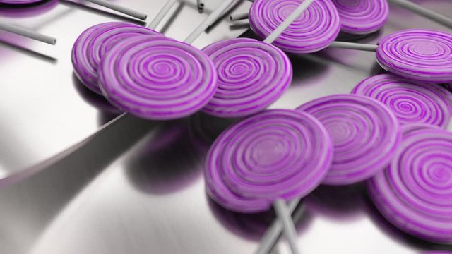 Purple lollipops production. Conveyor line. Metal texture