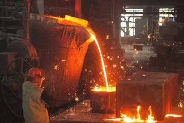 Work in the foundry. molten metal worker at a metallurgical plant