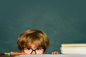 School bullying. First school day. Blackboard background. Elementary school. Cute little preschool...
