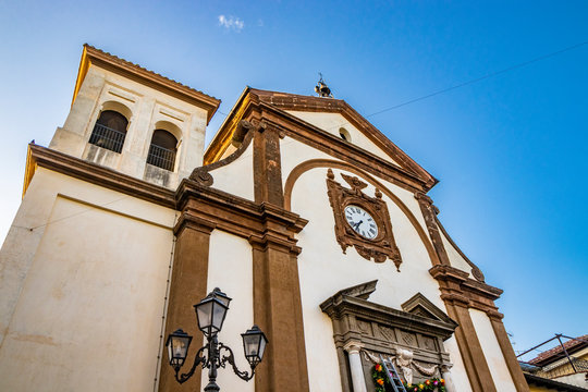 The Church of San Lorenzo martyr. The big clock on the wall. The blue sky at sunset. Zagarolo, Province of Rome, Lazio, Italy