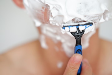 close up man of shaving on face isolated background