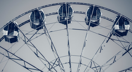 Old carousel, ferris wheel in an amusement park
