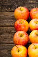 apple fruits in a row, old weathered wood table background