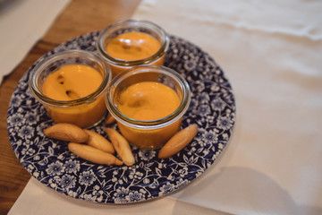 Rich Spanish salmorejo dish, with olive oil and bread spikes.