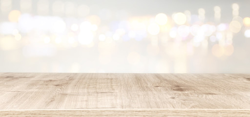 background of wooden table in front of abstract blurred window light. banner