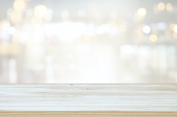 background of wooden table in front of abstract blurred window light