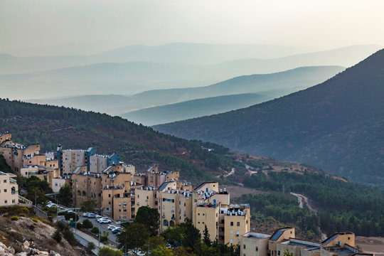 View of Galilee mountains from the Holy city of Safed or Tsfat Israel in the evening. Mountain hills in fog.