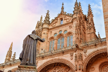 Fototapeta na wymiar Statue of a priest in front of the cathedral of Salamanca, Spain