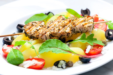 still life of grilled turkey meat with potatoes