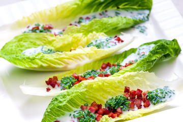 still life of Roman salad with bacon