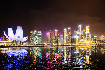 SINGAPORE, SINGAPORE - MARCH 2019: skyline of Singapore Marina Bay at night downtown core...