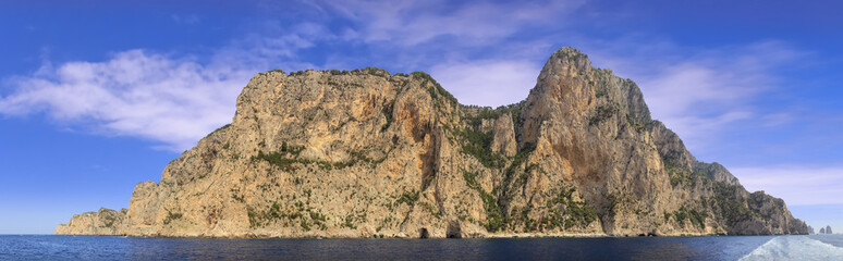 Landscapes of the island of Capri from the sea.View of the coastline with the rocky shores and sea caves.