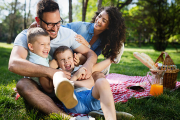 Cheerful happy family picnicking on a beautiful day