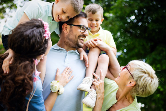 Multi Generation Family Enjoying Picnic In A Park