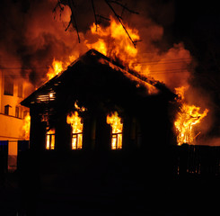 An old Wooden house burning