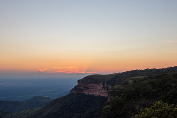 Slope view from the top with extensive sea wall as cut mountain at sunset