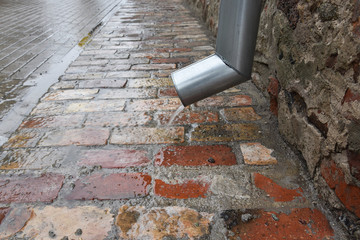 Rain water flowing from gutter.