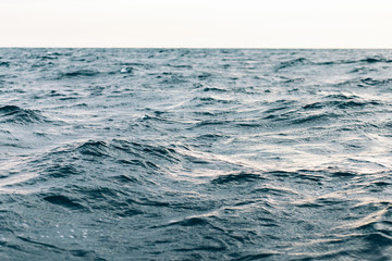 Naklejka na ściany i meble dark blue sea water background, shades of blue in black sea