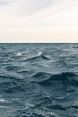 Plakat dark blue sea water background, shades of blue in black sea