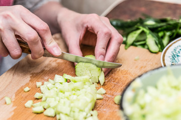 hands cutting vegetables