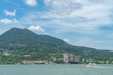 Fototapeta premium Tamsui is a sea-side district in New Taipei, Taiwan. The town is popular as a site for viewing the sun setting into the Taiwan Strait.