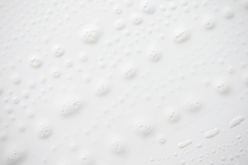 Abstract background white soapy foam texture. Shampoo foam with bubbles