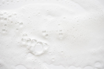 Abstract background white soapy foam texture. Shampoo foam with bubbles