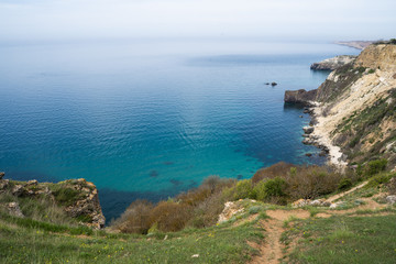 Mediterranean coast with high cliffs and rough sea